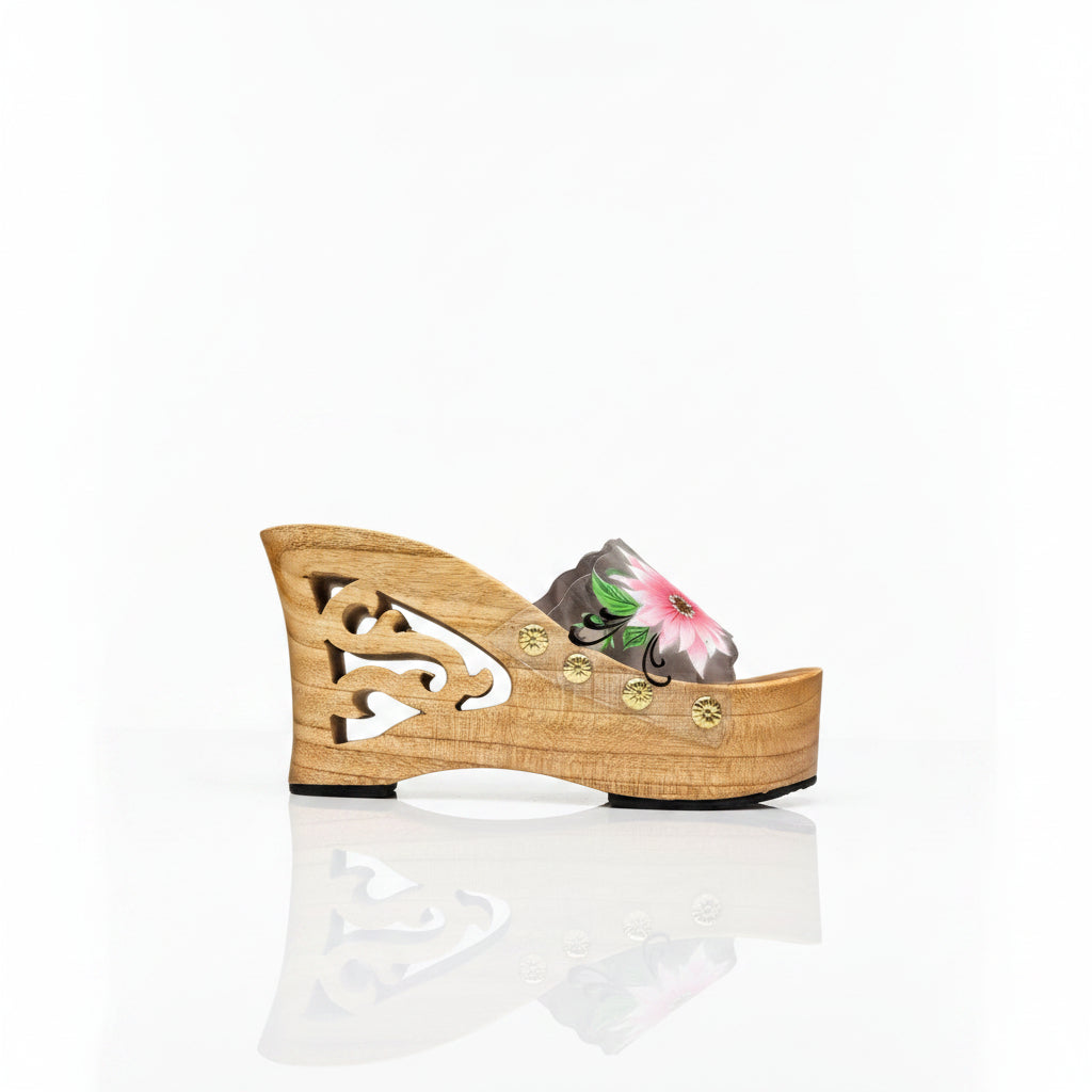 A single women's platform wedge sandal with a light natural wood platform and heel, featuring a floral embroidered strap in pink, green, and gray, and small gold-tone decorative studs.